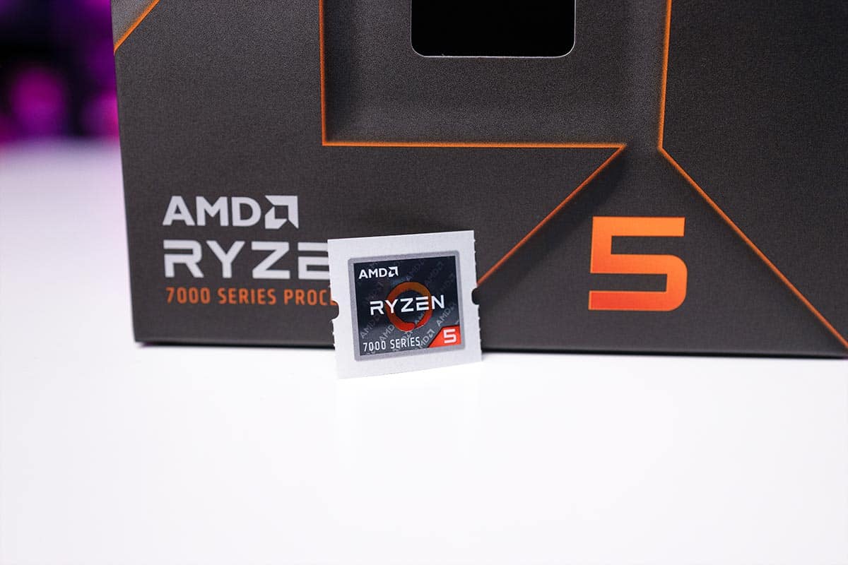 AMD Ryzen 5 7600X CPU in front of its packaging, featuring the "7000 series processor" label.
