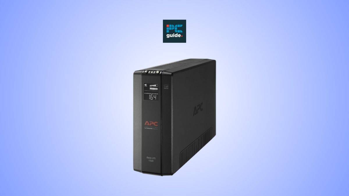 A black APC uninterruptible power supply (UPS) unit against a blue background, featuring a digital display on its front panel. Hailed as the best uninterruptible power supply by many, it ensures your devices stay powered during unexpected outages.