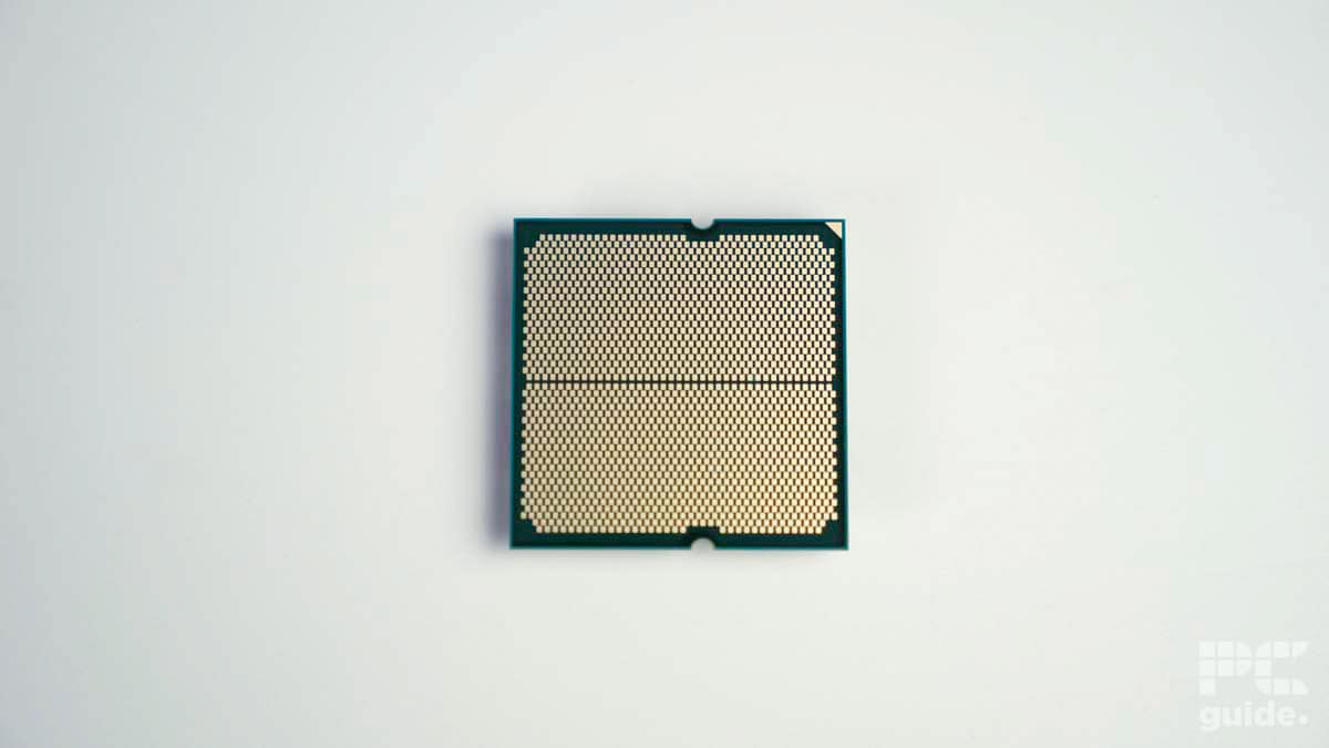 7800X3D facing down showing contact pads on a white table