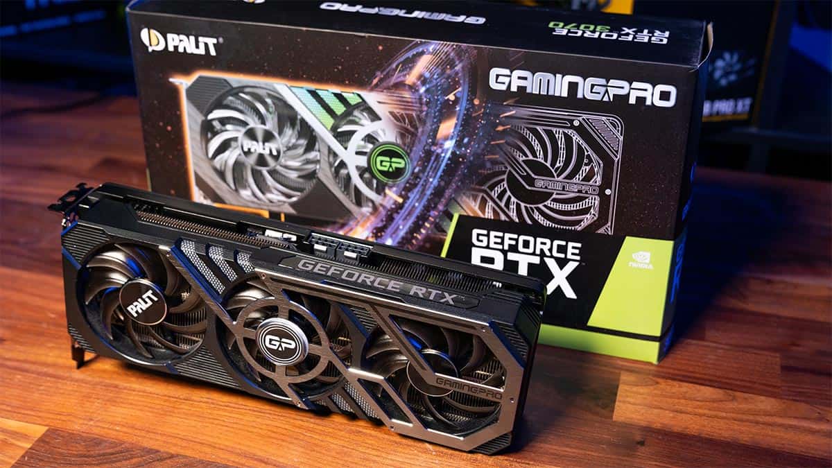 Palit GeForce RTX 3070 graphics card in front of its packaging box with RGB lighting in the background.