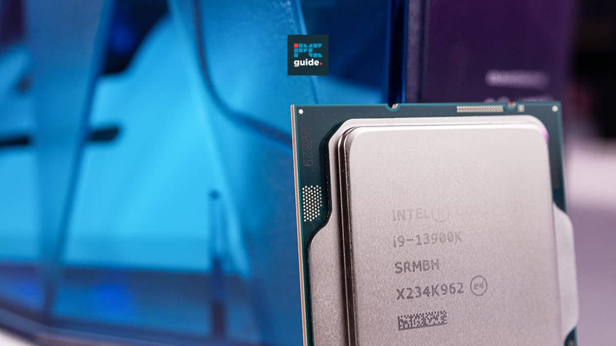 Close-up of one of the best CPUs for video editing, the Intel i9-13900k, in front of a blurred computer setup.