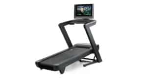A NordicTrack 2450 treadmill equipped with a built-in TV for a commercial setting.