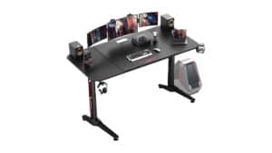A VITESSE 63" gaming desk equipped with a monitor and speakers.