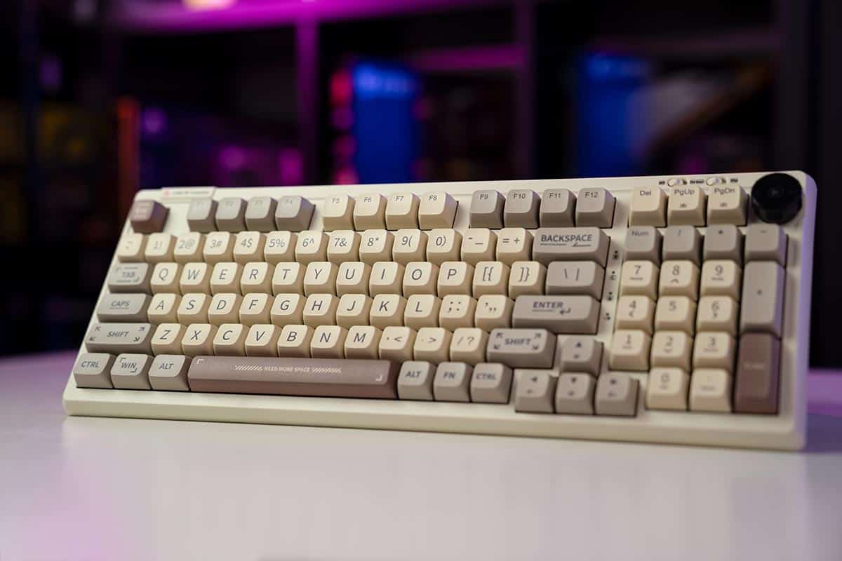The Epomaker RT100 keyboard sitting on a table.