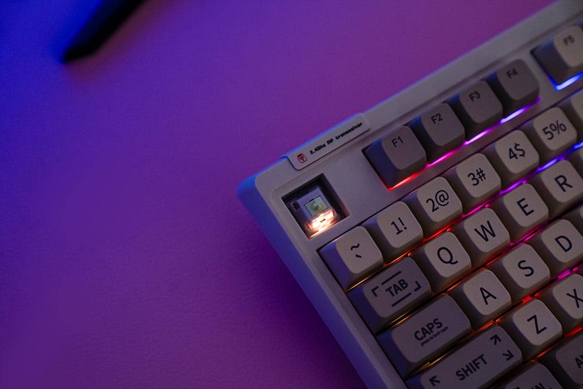 A retro-styled keyboard, the Epomaker RT100, featuring a light.