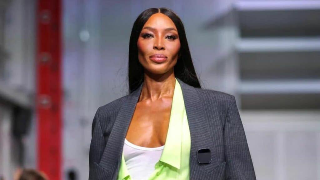 Naomi Campbell wears the Humane AI pin smart wearable at the Coperni Paris fashion show, 2023.