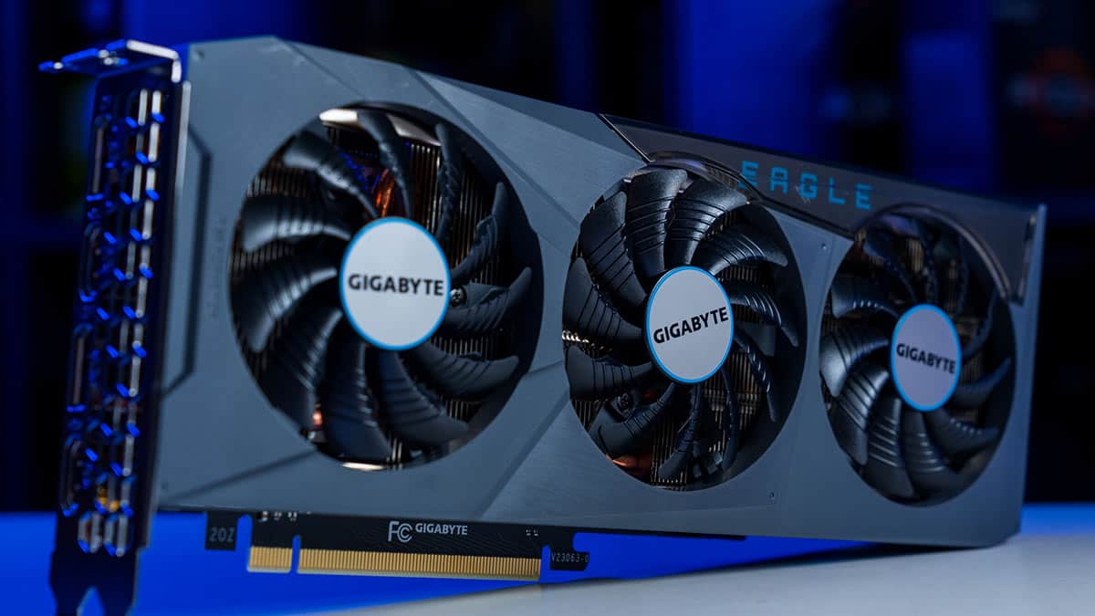 A Gigabyte GeForce RTX 4070 Eagle OC graphics card with triple-fan cooling setup on a blue-lit background.