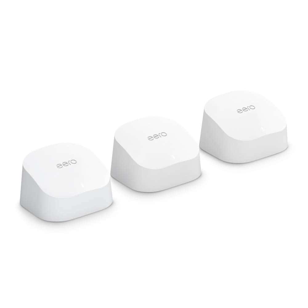 A row of white computer keys with a mesh Wi-Fi system.