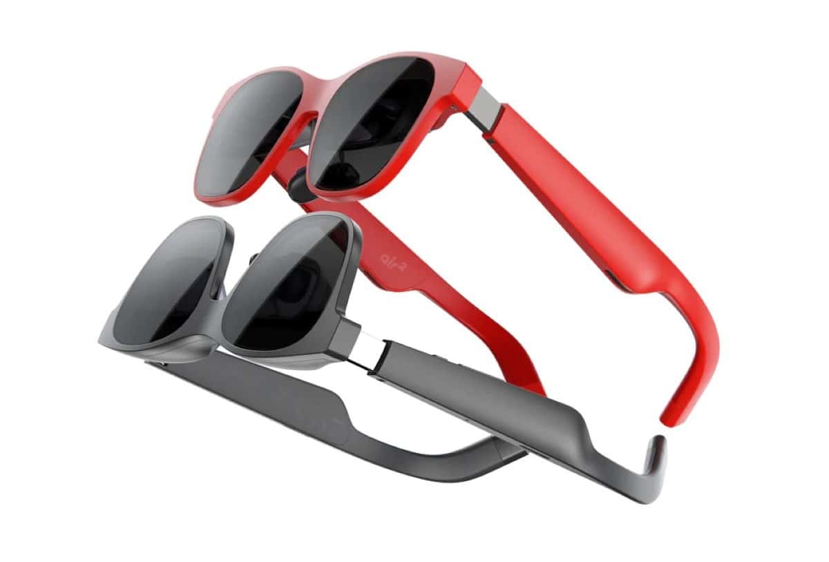 A pair of red and black sunglasses do exist on a white background.