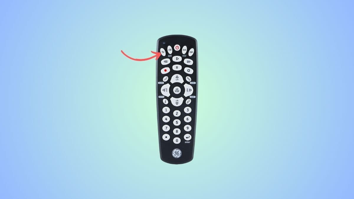 Seiki TV remote control with a red arrow pointing to TV button.