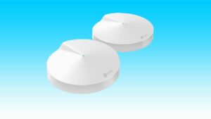 Two TP-Link white wi-fi routers on a blue background.