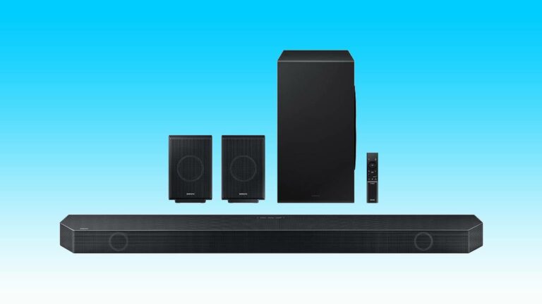 A black home theater system with surround-sound speakers and a subwoofer.