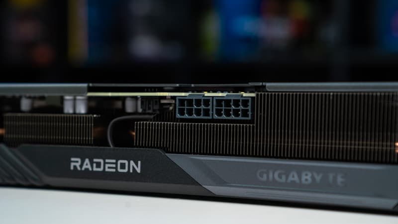A close up of an AMD Radeon RX 7600 XT graphics card.