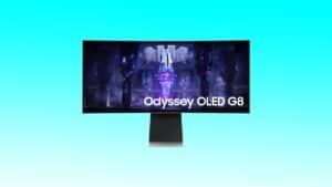 The Samsung Odyssey Ode 66 monitor is displayed on a blue background.