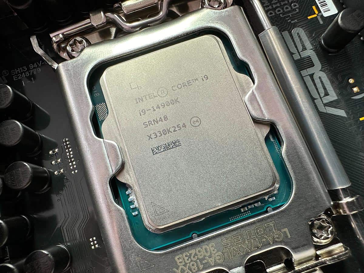A close-up of an Intel Core i9-14900K CPU installed in a motherboard socket.