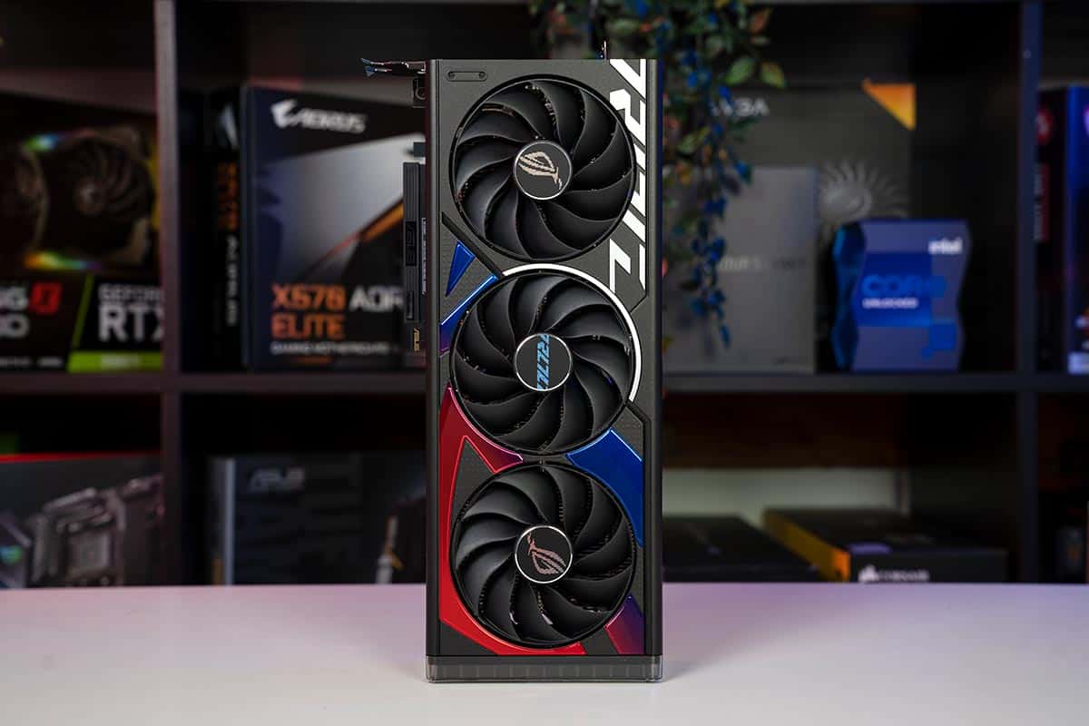 Image shows the ASUS ROG Strix Gaming RTX 4060 OC edition on a white desk in front of a blurred backgroud.
