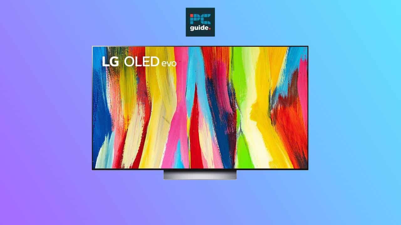 An LG C2 OLED TV displaying vibrant, abstract art against a blue and purple gradient background.