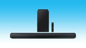 Samsung soundbar with subwoofer and remote control against a blue background, available at a discount on Amazon.