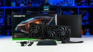 A Gigabyte GeForce RTX 4080 Super graphics card with its box and accessories displayed on a desk with colorful LED lighting in the background.