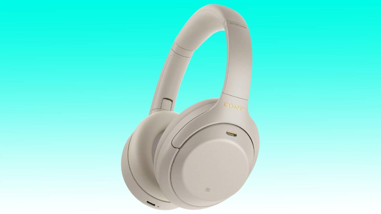 White Sony XM4 over-ear headphones against a gradient background.