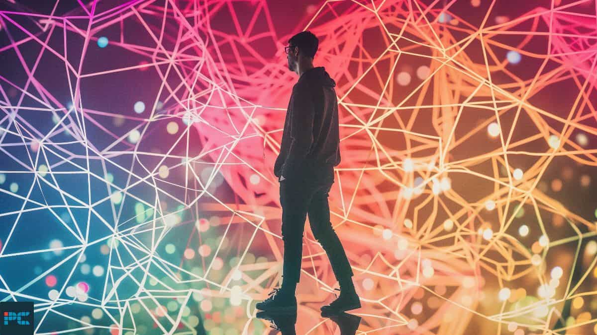 Who owns Devin AI - Silhouetted figure against a vibrant, geometric light display