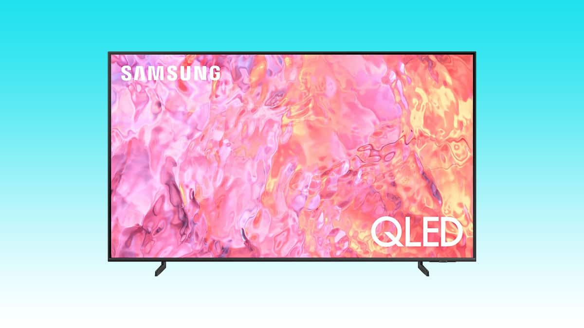 Samsung 75" QLED 4K Q60C smart TV displaying a vibrant abstract image on a blue background.