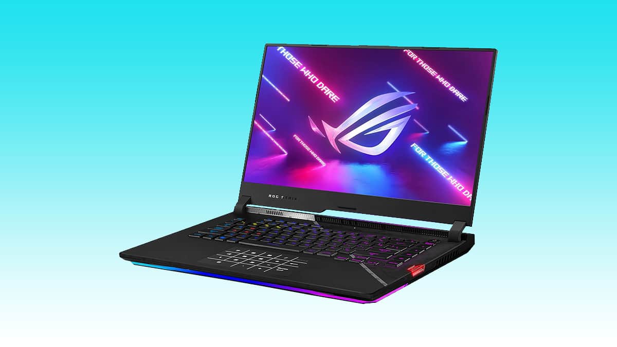 Gaming laptop with RGB keyboard and auto-draft logo on display screen against a blue gradient background.