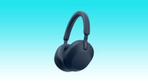Black over-ear wireless auto draft headphones against a blue background.