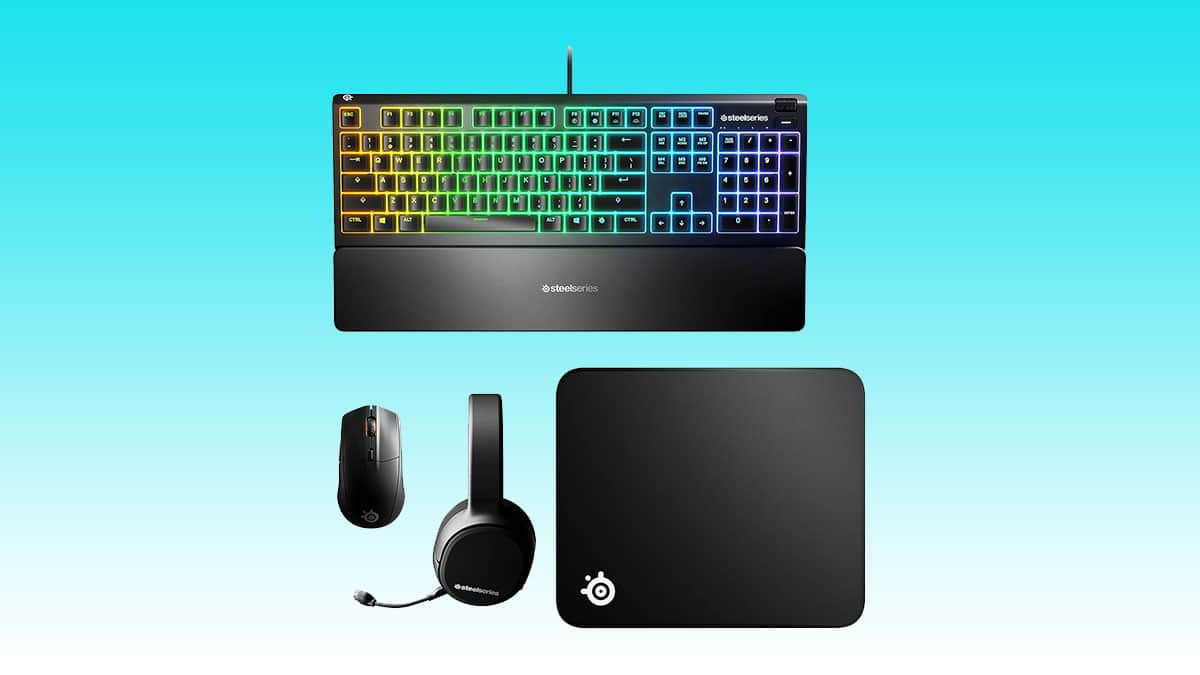 Gaming peripherals including a colorful backlit keyboard, mouse, headset, and Steelseries mousepad.