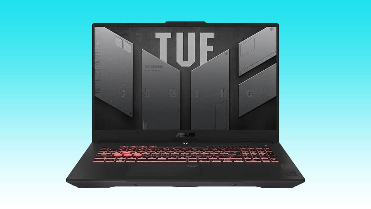 Asus TUF A15 gaming laptop with backlit keyboard on a blue background.