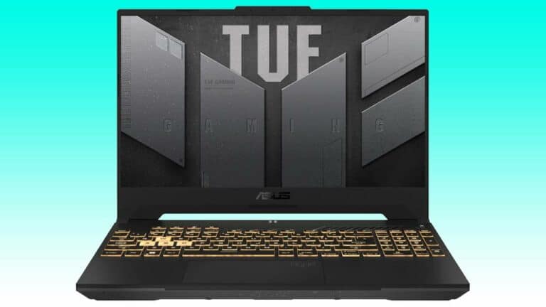 An asus tuf gaming laptop with a black and gold keyboard, the display lid open, showing the auto draft logo on the screen.