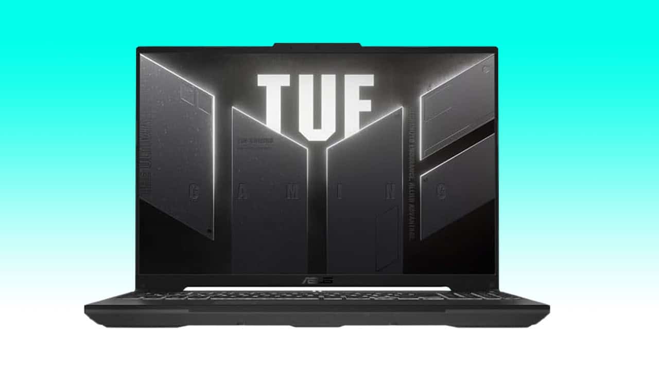 A black ASUS TUF Gaming A16 laptop open and facing forward, with the TUF Gaming logo illuminated on the lid, displayed against a teal background.