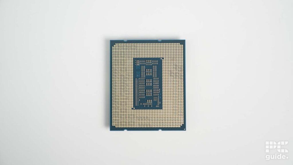 A computer processor chip, specifically the Intel Core i7-14700K, centered on a plain white background with the word "guide" in the corner.