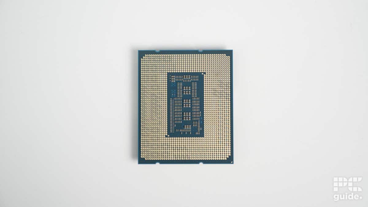 A computer processor chip, specifically the Intel Core i7-14700K, centered on a plain white background with the word "guide" in the corner.