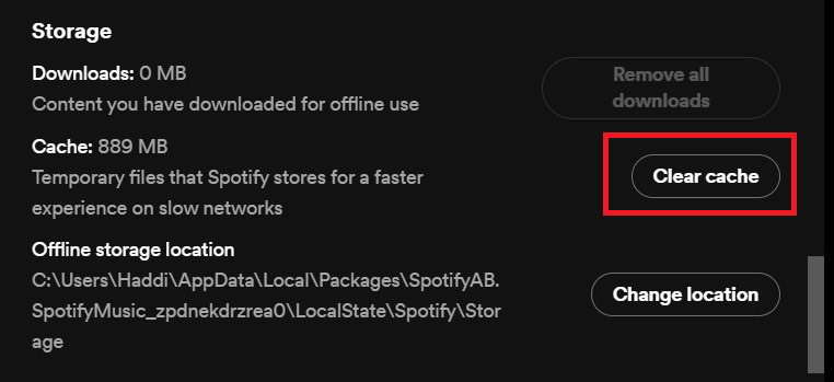 Screenshot of a storage settings window showing options for managing downloaded content and clearing cache, highlighted on the "clear cache" button to optimize Spotify performance.