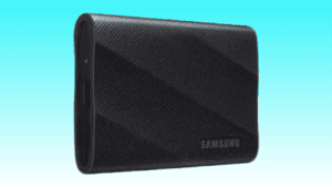 A black SAMSUNG T9 Portable SSD with a textured surface on a light blue background.