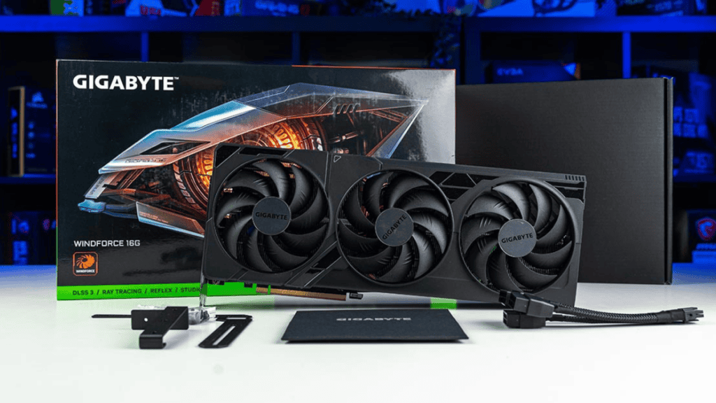 A Gigabyte RTX 4080 Super prebuilt graphics card with triple fan design placed in front of its box and accessories.