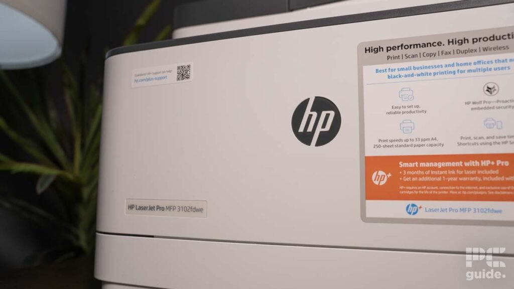 Close-up of an HP LaserJet Pro MFP 3102fdwe multifunction printer highlighting its features on the box.