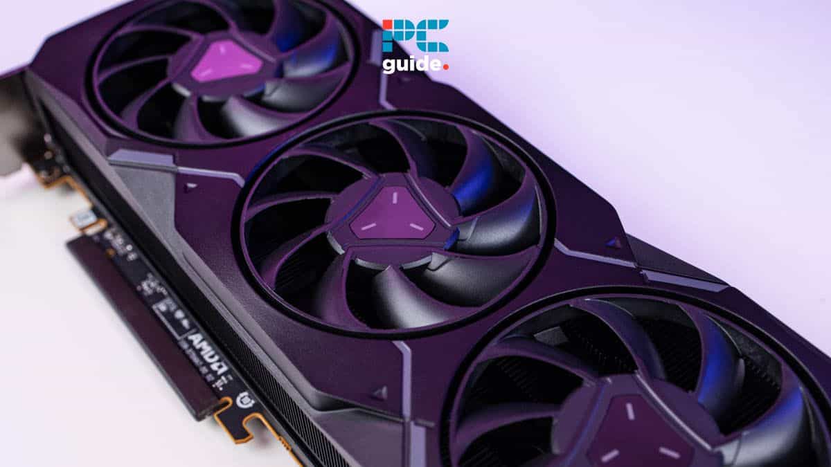 Close-up of a modern graphics card with three fans and purple accents against a light purple background, displaying a logo that reads "pc guide," emphasizing the ability to adjust GPU fan speed.