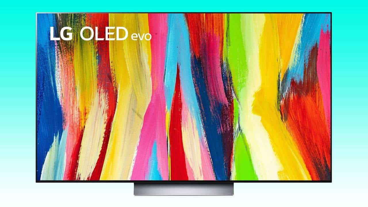 An April deal on a vibrant, colorful abstract image displayed on an LG 65-inch OLED TV purchased from Amazon.