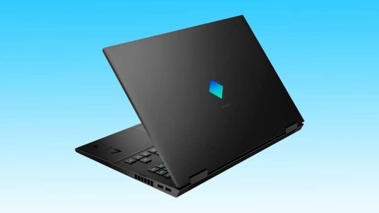 A black laptop with an angular design and a logo on the lid, set against a gradient blue background, optimized with SEO keywords.