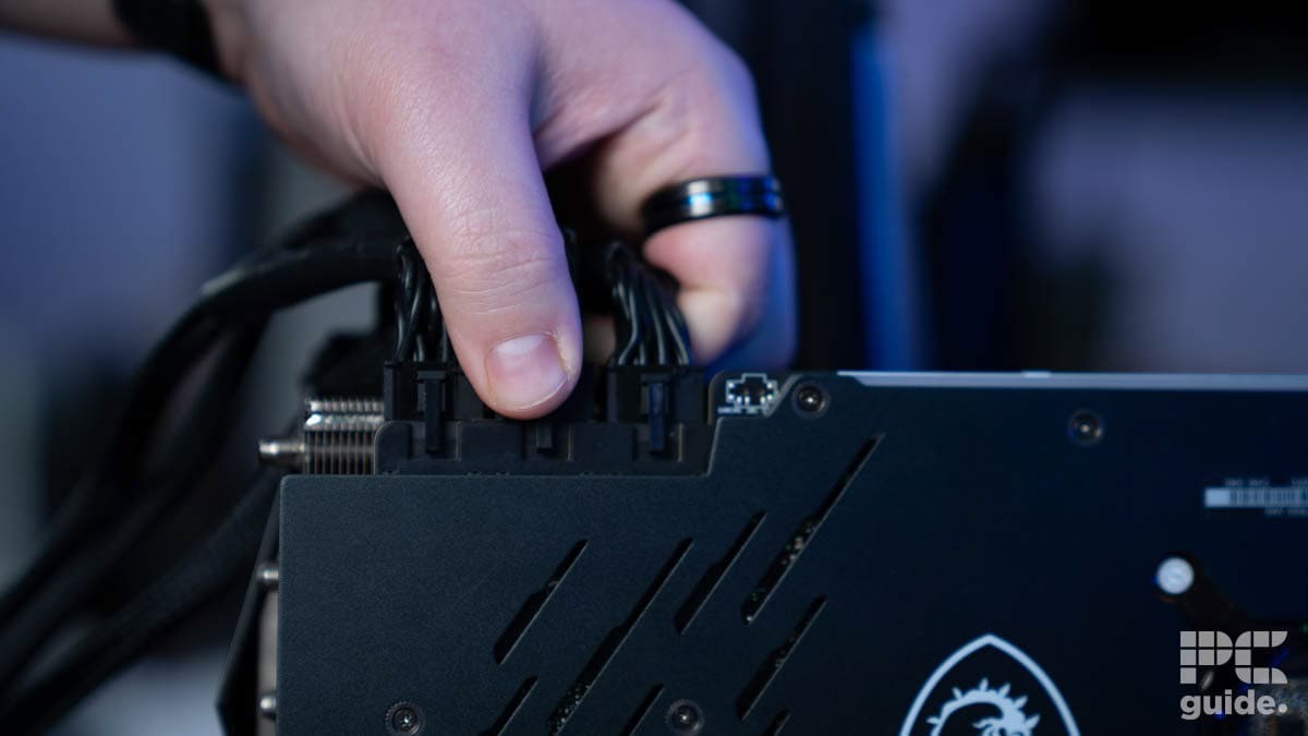 Sebastian Kozlowski securing a power cable for a GPU to be tested ©BGFG