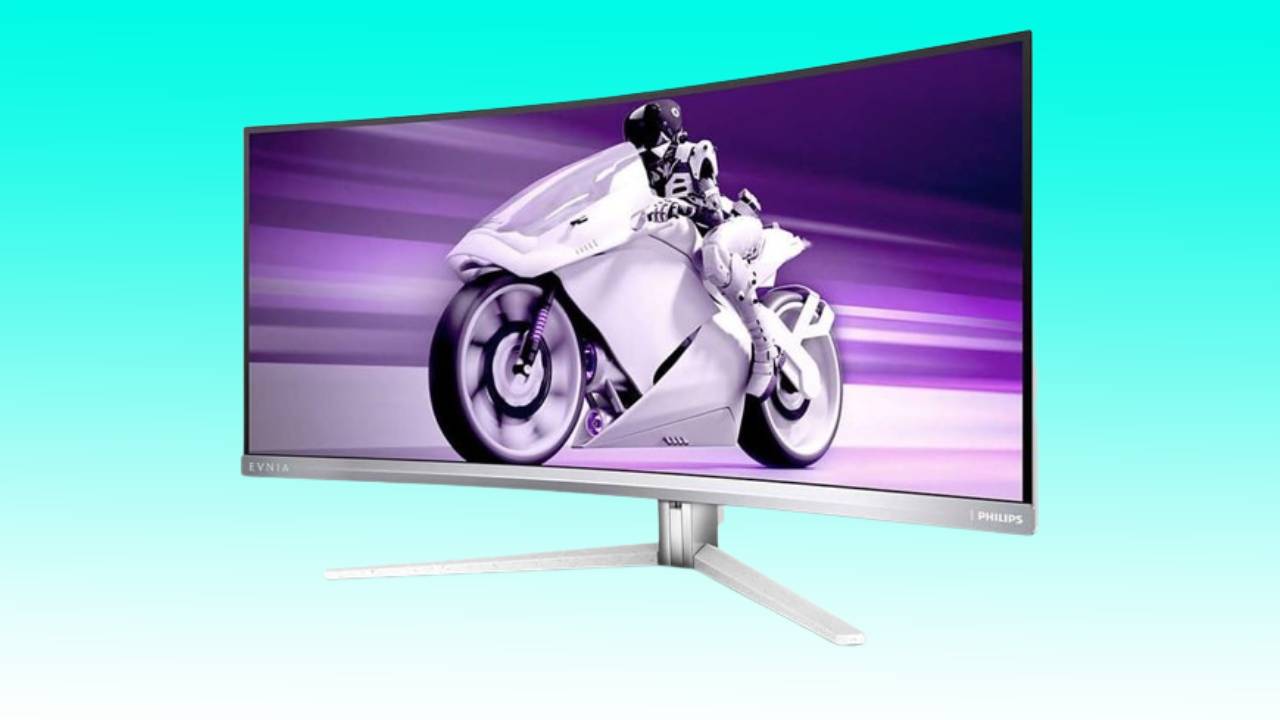 Curved monitor displaying a motorcycle and rider on a dynamic purple background, known as the best alternative to the Philips QD OLED Ultrawide, is the Alienware AW3423DWF.