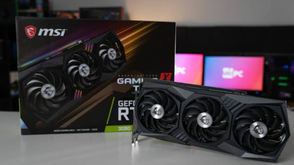 Nvidia geforce rtx 3080 graphics card in front of its box with MSI branding, set against a blurred background with colorful PC lighting for the best rtx 3080 gaming PC.