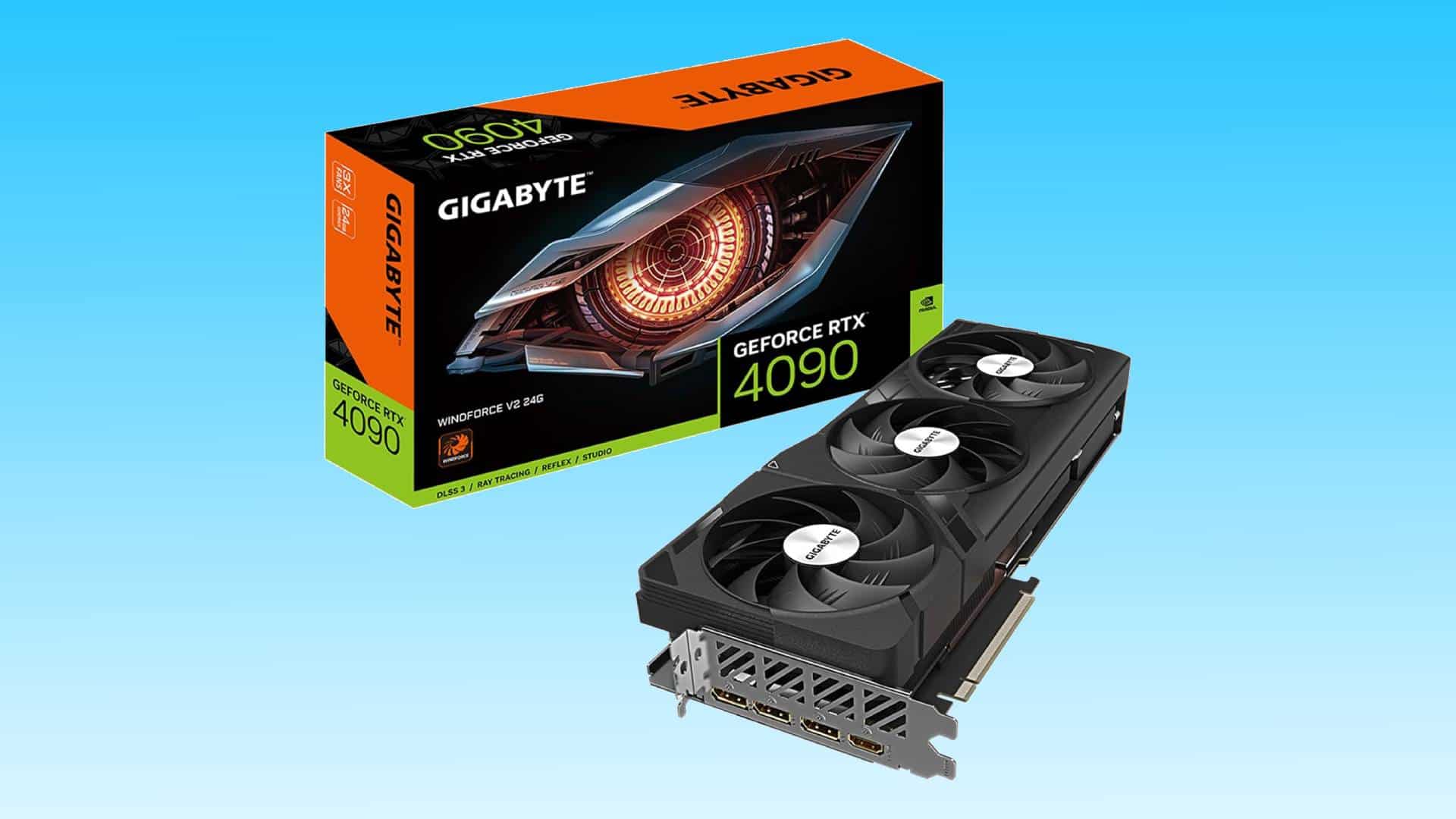 A gigabyte geforce rtx 4090 graphics card with three fans, displayed next to its orange and black retail box on a light blue background, now with a price slashed.