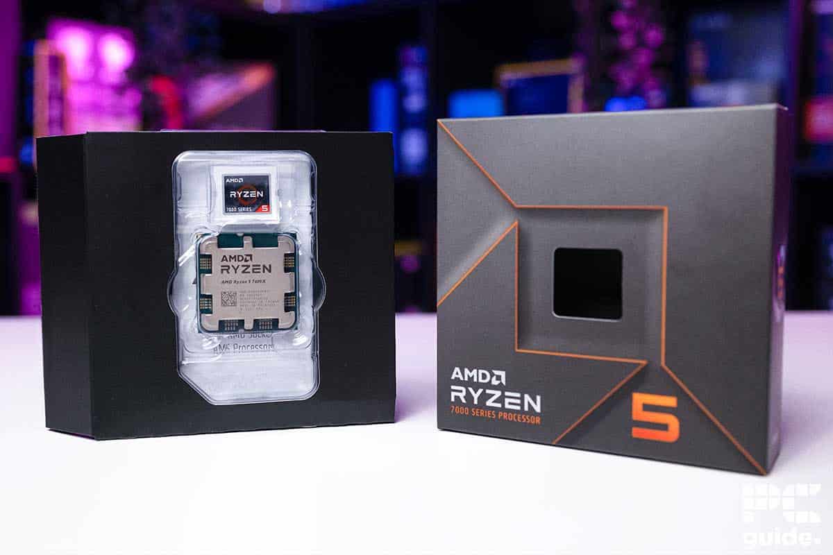 Ryzen 5 7600X review of a processor in packaging, displayed against a blurred colorful background.