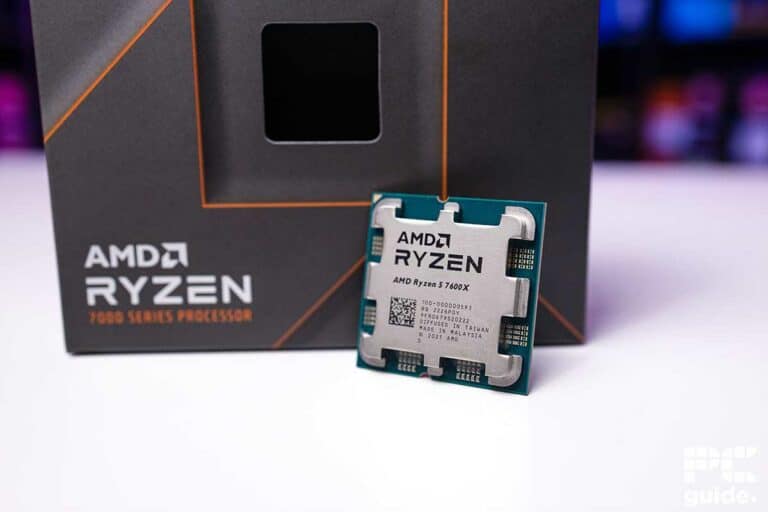 Two AMD Ryzen 7000 series processor boxes, with a focus on the AMD Ryzen 5 7600X processor chip in front, ready for a detailed review.