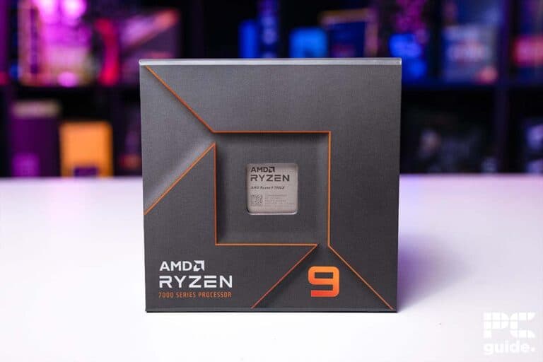 AMD Ryzen 9 7900X series processor box on a blurred colorful background.