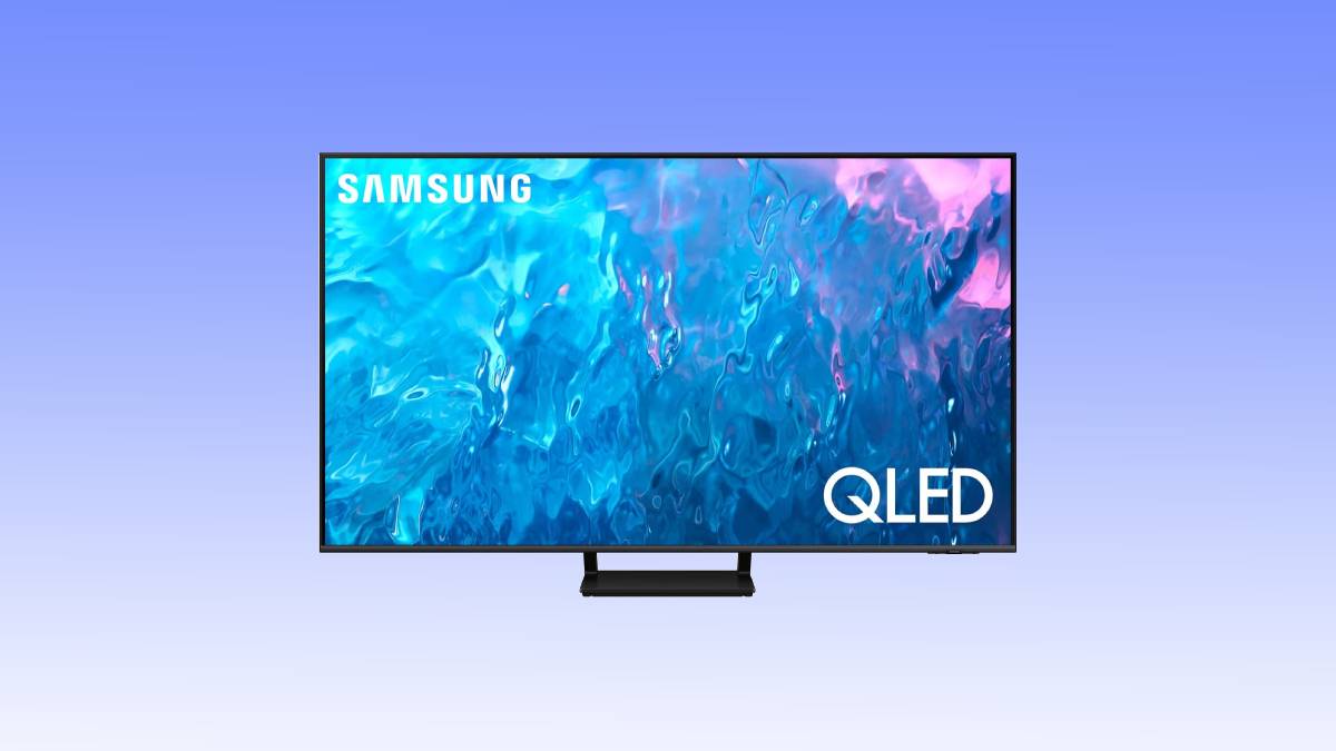 Samsung qled tv deal showcasing vibrant blue and pink abstract imagery on screen, set against a plain light blue background.
