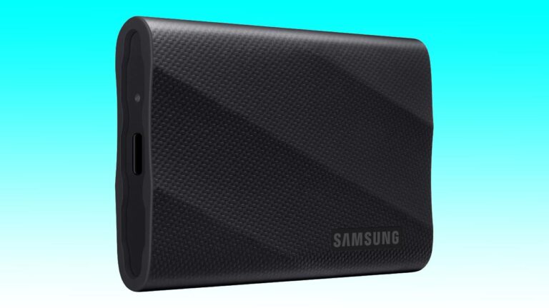 A black 4TB Samsung T9 portable SSD with a textured surface, displayed against a light blue background.